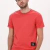 Calvin Klein T-shirt Badge Turn Up Sleeve En Orange Retour gratuit en magasin. 17