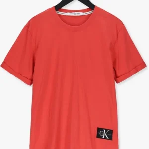 Calvin Klein T-shirt Badge Turn Up Sleeve En Orange Retour gratuit en magasin. 13